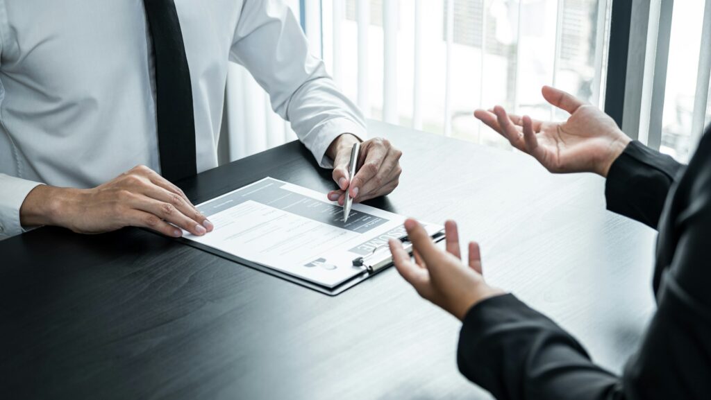 Businesswoman candidate present and explaining her profile to selection committee manager