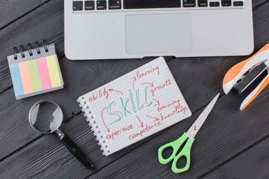 Skills concept and stationery accessories flat lay.