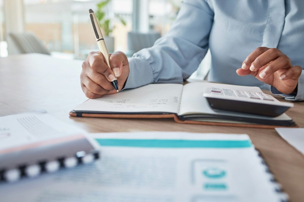 Woman in accounting, payroll, tax, credit and bank payment for startup company in an office. Busine