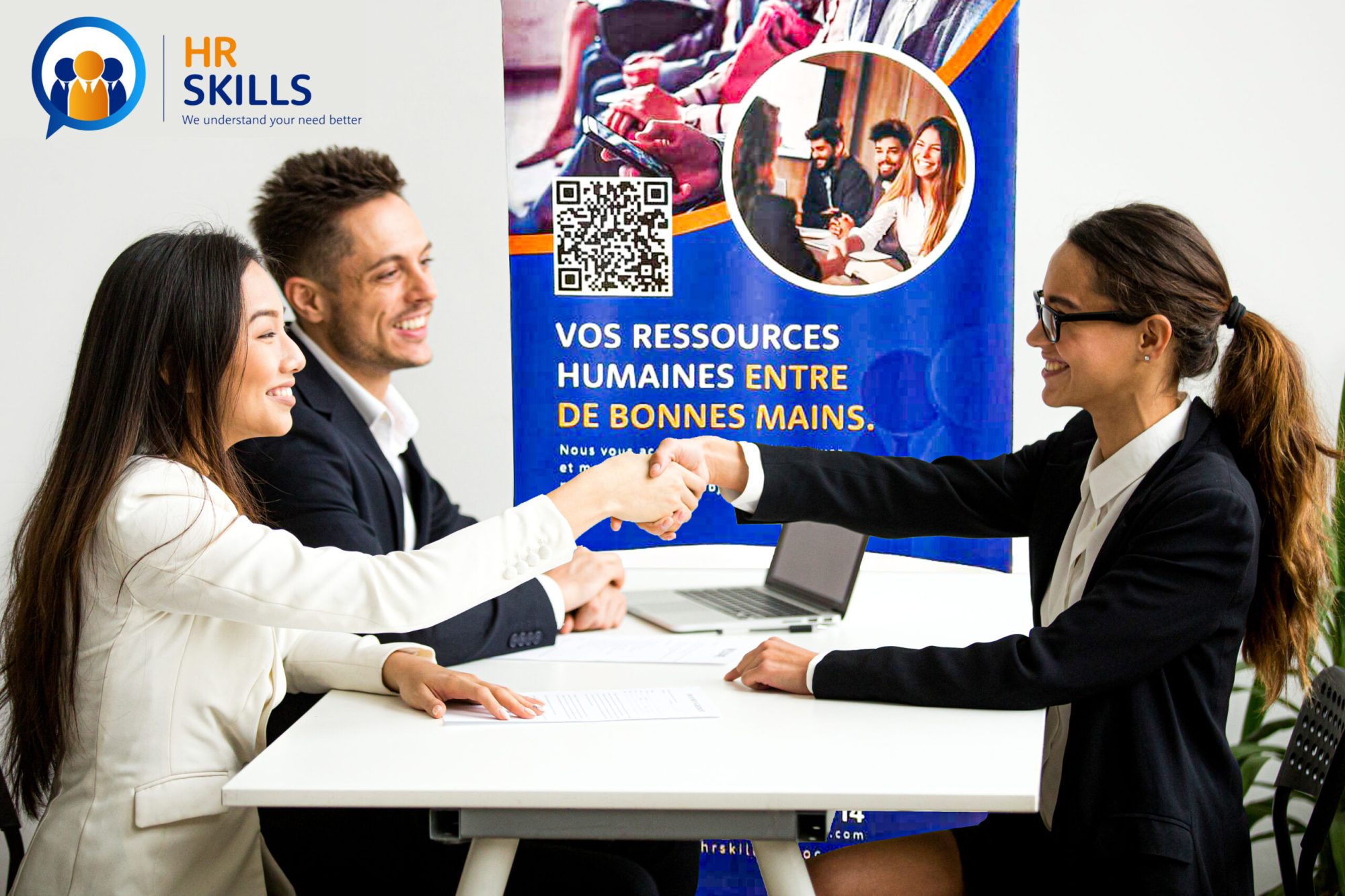 Smiling diverse businesswomen shake hands at group meeting, friendly asian hr handshaking congratulating hired applicant at job interview, satisfied millennial partners make contract deal concept